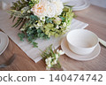 A natural table setting decorated with flowers. 140474742