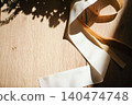 Ribbons in sunlight against a wood grain background 140474748