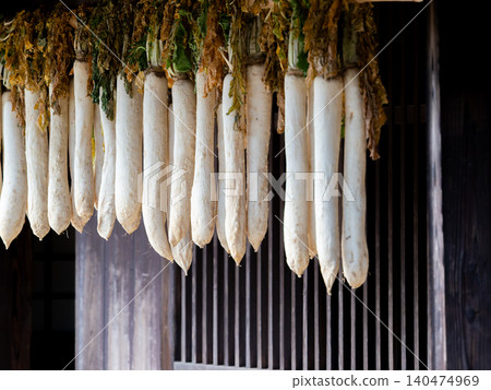 A winter tradition: dried radishes hanging from the eaves. 140474969
