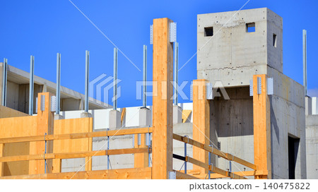 Laminate wood floors and supports of a mass timber multi story green, sustainable office building construction project. The building structure also has concrete walls. Laminate wood floors and supports of a mass timber multi story green, sustainable office building construction project. The building structure also has concrete walls. 140475822