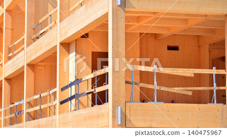 Laminate wood floors and supports of a mass timber multi story green, sustainable office building construction project Laminate wood floors and supports of a mass timber multi story green, sustainable office building construction project 140475967
