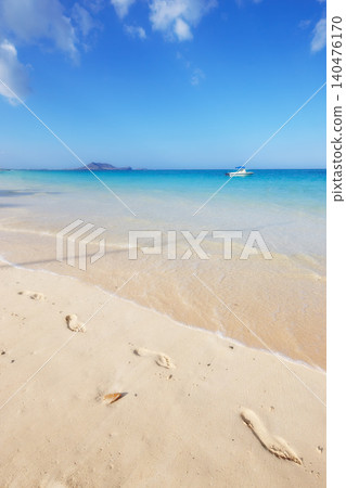 Ocean, Bali and blue sky for holiday, sand and rocks in shore for peace and tranquility. Seaside, waves and summer for vacation, location and beach for clear water on travel and tropical trip Ocean, Bali and blue sky for holiday, sand and rocks in shore for peace and tranquility. Seaside, waves and summer for vacation, location and beach for clear water on travel and tropical trip 140476170