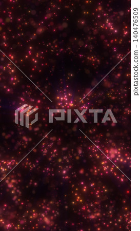Dark abstract background filled with glowing pink and orange particles, creating a dreamy cosmic sparkle effect with soft bokeh depth. 140476509