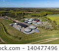 Wide aerial perspective of an industrial biogas plant nestled in the rural countryside of Hammel, Denmark 140477496