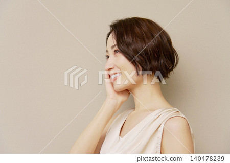 Middle-aged woman portrait brown background Middle-aged woman portrait brown background 140478289