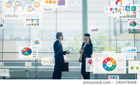 Group of business people talking in lobby with business data 140478406