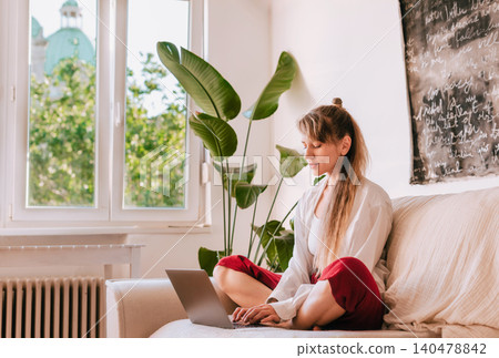 Young Woman Working Remotely from Home Young Woman Working Remotely from Home 140478842