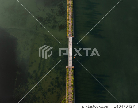 Aerial View of a Long Pier Stretching Over Calm Waters in Nanning, China Aerial View of a Long Pier Stretching Over Calm Waters in Nanning, China 140479427