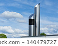 Minimalist metal chimney against blue sky 140479727