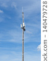 Telecommunication tower with antennas against blue sky 140479728