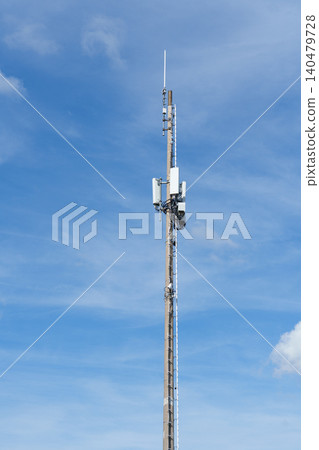 Telecommunication tower with antennas against blue sky 140479728