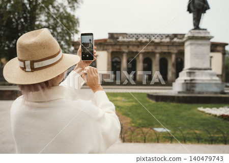 Woman Taking Photo of Monument with Smartphone Woman Taking Photo of Monument with Smartphone 140479743