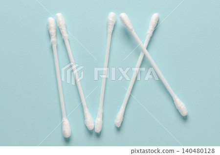 Cotton swabs for hygiene. Blue background. Cotton swabs for hygiene. Blue background. 140480128