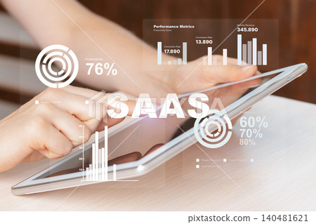 Using a tablet to view performance metrics for Saas application in an office setting Using a tablet to view performance metrics for Saas application in an office setting 140481621