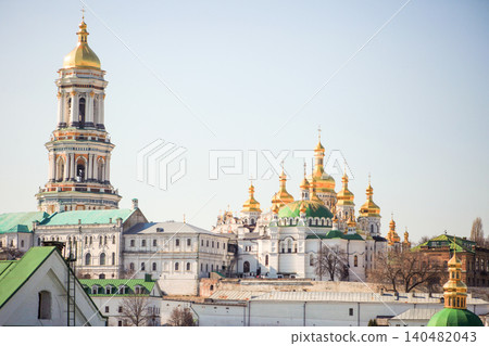 Assumption Cathedral 11th century church. Domes of Kyiv Pechersk Lavra Monastery Architecture. Built in 1073 year in Ukraine Assumption Cathedral 11th century church. Domes of Kyiv Pechersk Lavra Monastery Architecture. Built in 1073 year in Ukraine 140482043