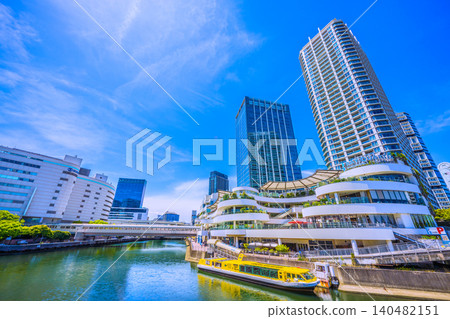 A view of Yokohama, Japan, from the north-east exit side of Yokohama Station, overlooking Yokohama Bay Quarter and JR Yokohama Tower. 140482151