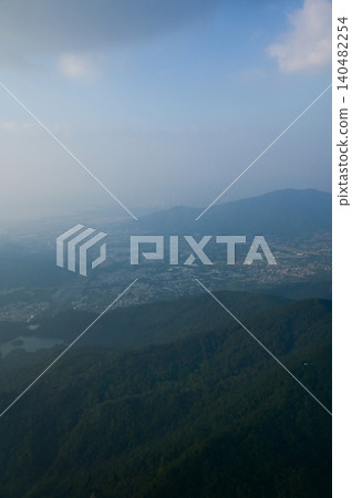 Looking from the airplane window with Hong Kong cityscape. The view of Hong Kong city, Hong Kong landscape from the above. Landscape, travel concept and nature scene.  140482254
