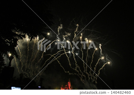 Stunning and colorful fireworks display in the night sky. Real fireworks background. Abstract of real shining fireworks against black background. Glowing fireworks show for celebration. Stunning and colorful fireworks display in the night sky. Real fireworks background. Abstract of real shining fireworks against black background. Glowing fireworks show for celebration. 140482460