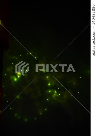 Stunning and colorful fireworks display in the night sky. Real fireworks background. Abstract of real shining fireworks against black background. Glowing fireworks show for celebration. Stunning and colorful fireworks display in the night sky. Real fireworks background. Abstract of real shining fireworks against black background. Glowing fireworks show for celebration. 140482880