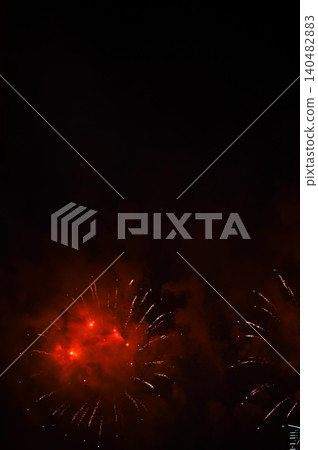Stunning and colorful fireworks display in the night sky. Real fireworks background. Abstract of real shining fireworks against black background. Glowing fireworks show for celebration. Stunning and colorful fireworks display in the night sky. Real fireworks background. Abstract of real shining fireworks against black background. Glowing fireworks show for celebration. 140482883