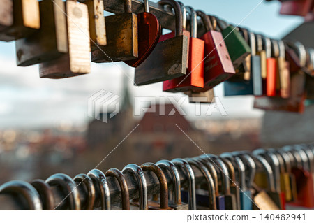 Locks on Metal Railing With Blurred City View 140482941