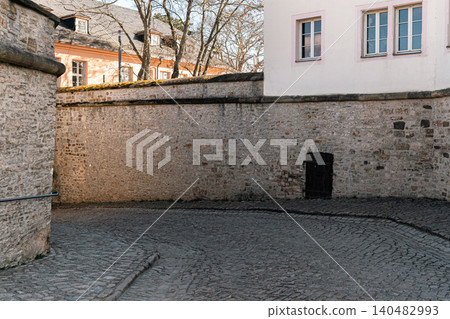 Historic Stone Wall and Cobblestone Street Texture 140482993
