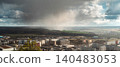 Storm Rain and Sunlight Over City Valley 140483053