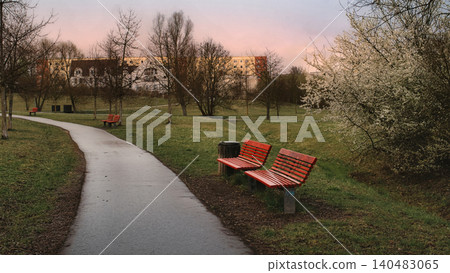 Red Benches Along Wet Park Path 140483065