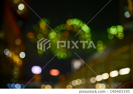 Bokeh effect of colorful fireworks display in the night sky. Real fireworks background. Abstract of real shining fireworks against black background. Glowing fireworks show for celebration. Bokeh effect of colorful fireworks display in the night sky. Real fireworks background. Abstract of real shining fireworks against black background. Glowing fireworks show for celebration. 140483195