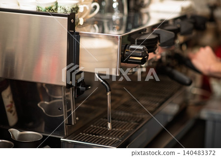 A close up view of a professional espresso machine in a cafe A close up view of a professional espresso machine in a cafe 140483372