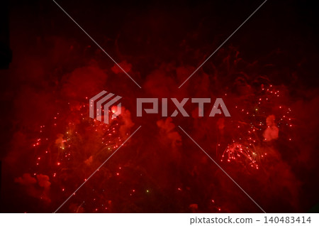 Stunning and colorful fireworks display in the night sky with smoke during explosion. Real fireworks background. Abstract of real shining fireworks against black background. for celebration. Stunning and colorful fireworks display in the night sky with smoke during explosion. Real fireworks background. Abstract of real shining fireworks against black background. for celebration. 140483414