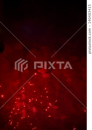 Stunning and colorful fireworks display in the night sky with smoke during explosion. Real fireworks background. Abstract of real shining fireworks against black background. for celebration. Stunning and colorful fireworks display in the night sky with smoke during explosion. Real fireworks background. Abstract of real shining fireworks against black background. for celebration. 140483415
