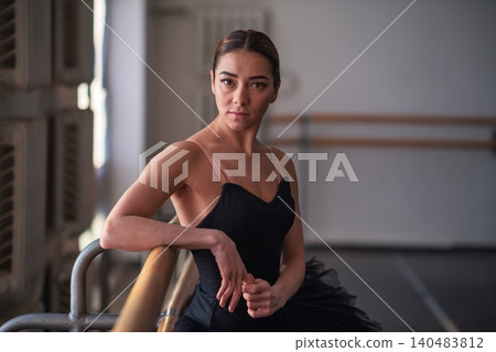 Female ballet dancer resting after rehearsal Female ballet dancer resting after rehearsal 140483812