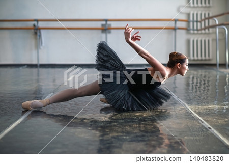 Young beautiful ballerina posing in ballet class Young beautiful ballerina posing in ballet class 140483820