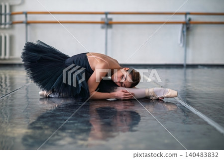 Young beautiful ballerina posing in ballet class Young beautiful ballerina posing in ballet class 140483832