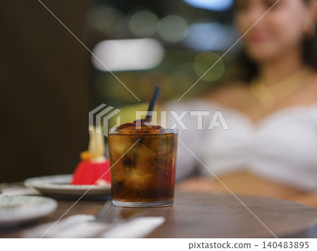 a cocktail in a glass on the table a cocktail in a glass on the table 140483895
