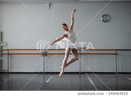 Beautiful ballerina practicing in ballet class Beautiful ballerina practicing in ballet class 140483910