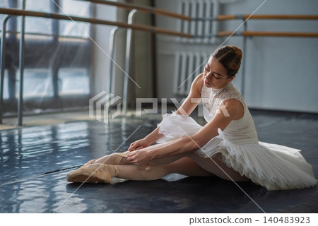 Beautiful ballerina posing in ballet class Beautiful ballerina posing in ballet class 140483923