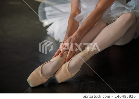 Closeup of ballet dancer legs in pointe shoes Closeup of ballet dancer legs in pointe shoes 140483926