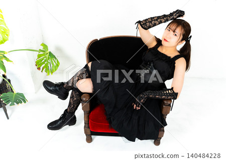 Woman in Gothic Lolita attire Woman in Gothic Lolita attire 140484228