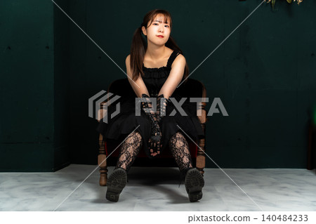 Woman in Gothic Lolita attire Woman in Gothic Lolita attire 140484233