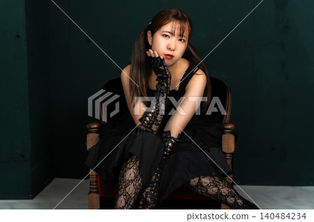 Woman in Gothic Lolita attire Woman in Gothic Lolita attire 140484234