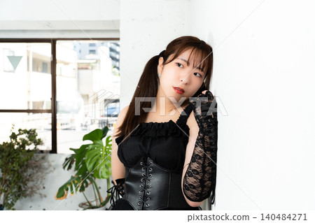 Woman in Gothic Lolita attire Woman in Gothic Lolita attire 140484271
