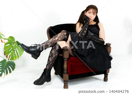 Woman in Gothic Lolita attire Woman in Gothic Lolita attire 140484276