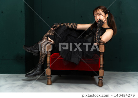Woman in Gothic Lolita attire Woman in Gothic Lolita attire 140484279