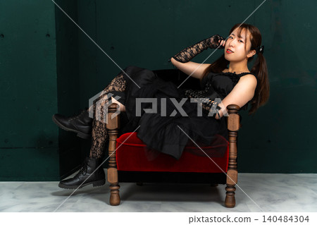 Woman in Gothic Lolita attire Woman in Gothic Lolita attire 140484304