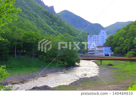 Sounkyo Onsen (Ishikari River, Kamikawa Town, Hokkaido) in the fresh green of spring 140484810