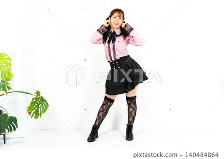 Woman in idol costume Woman in idol costume 140484864
