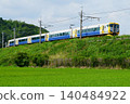 The Limited Express Ayame runs along the embankment of the Kashima Line. 140484922