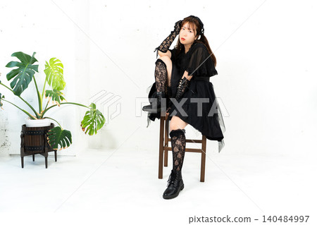 Woman in Gothic Lolita attire Woman in Gothic Lolita attire 140484997